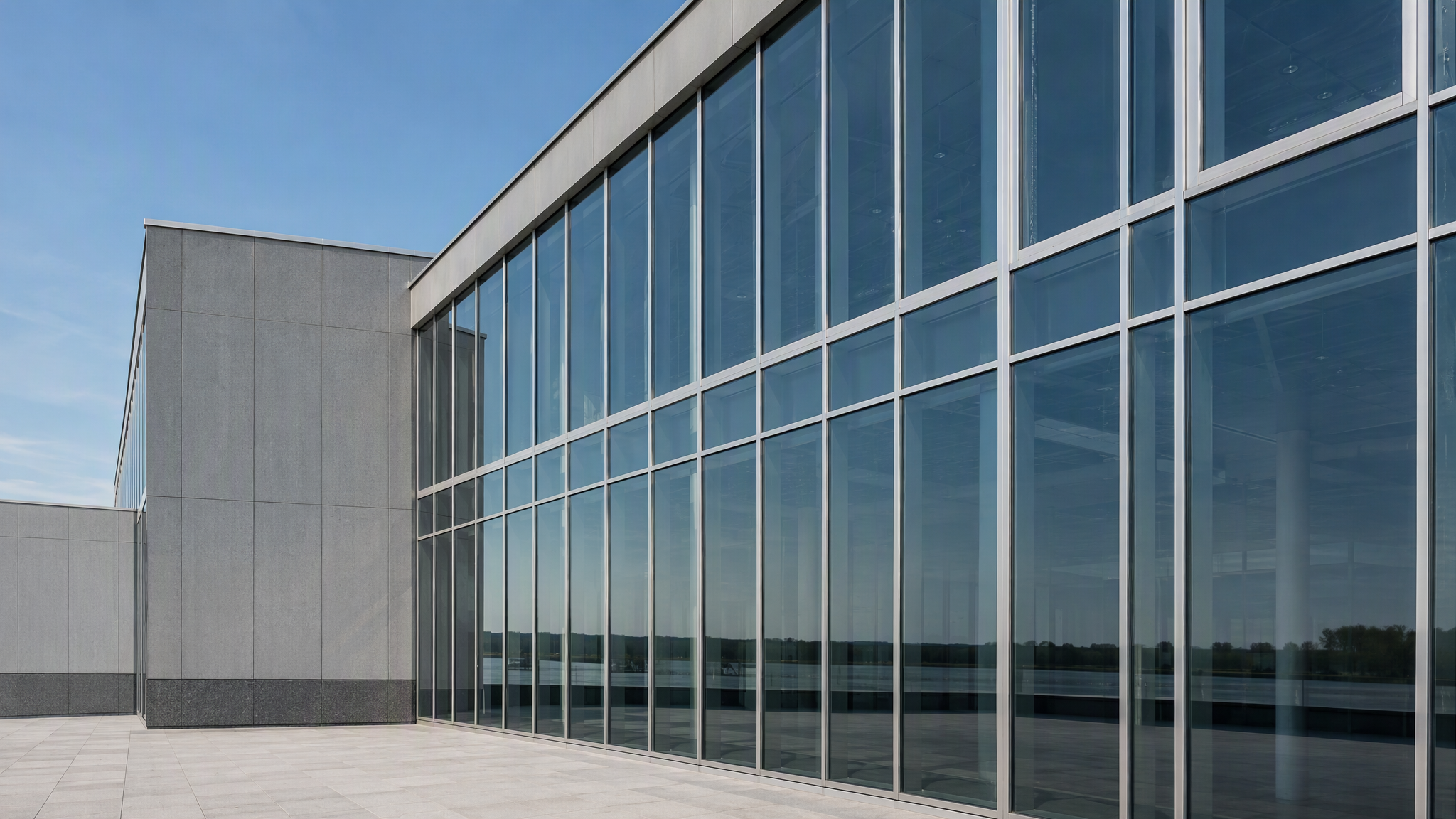 Modern building facade with satin brushed anodized aluminium window frames and mullions
